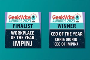 GeekWire Awards 2023 placards for Impinj, left as Finalist for Workplace of the Year, and right as Winner for CEO of the Year Chris Diorio.